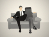 man with arm around smartphone on sofa